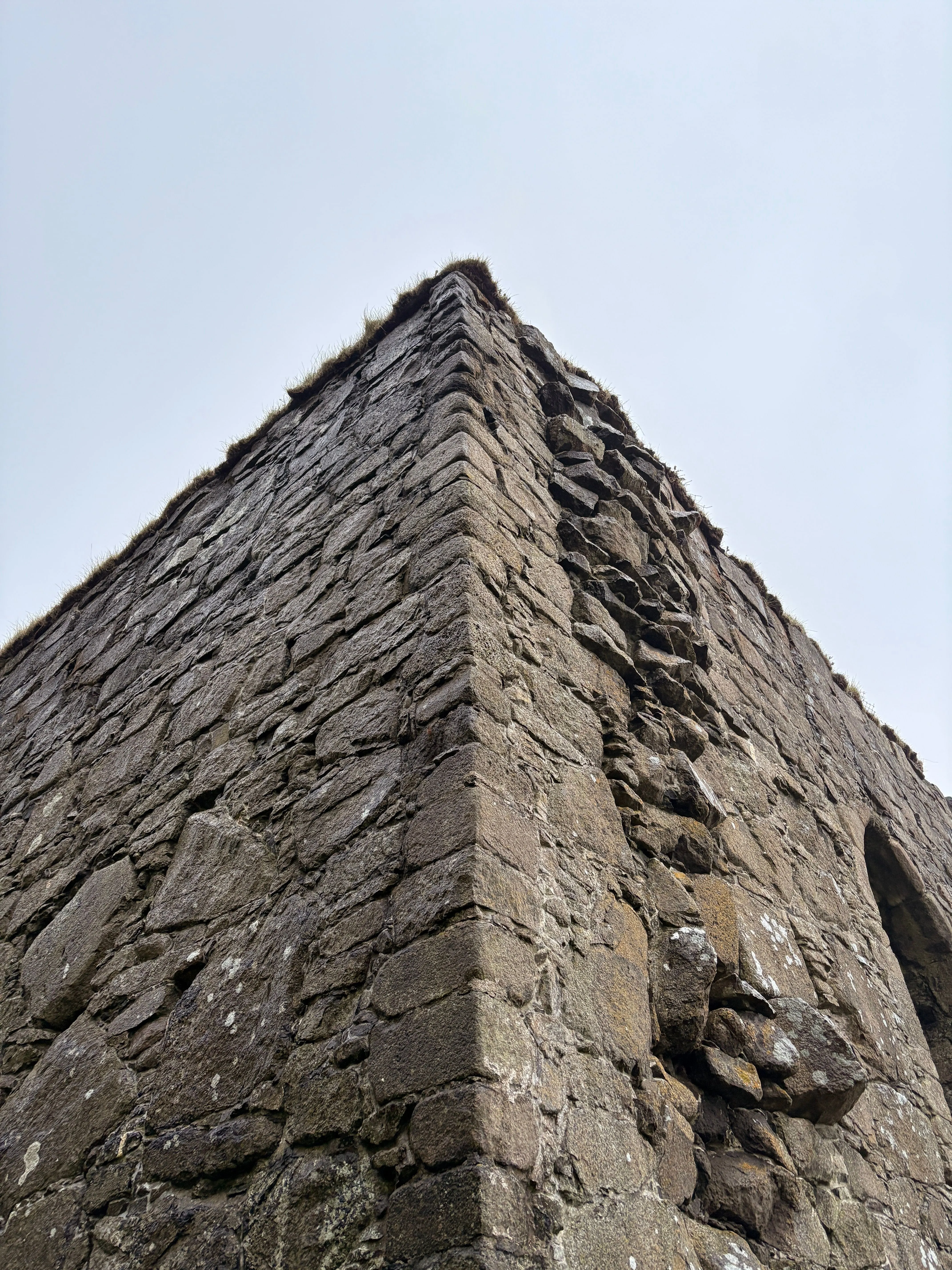 Stone building corner viewed from below